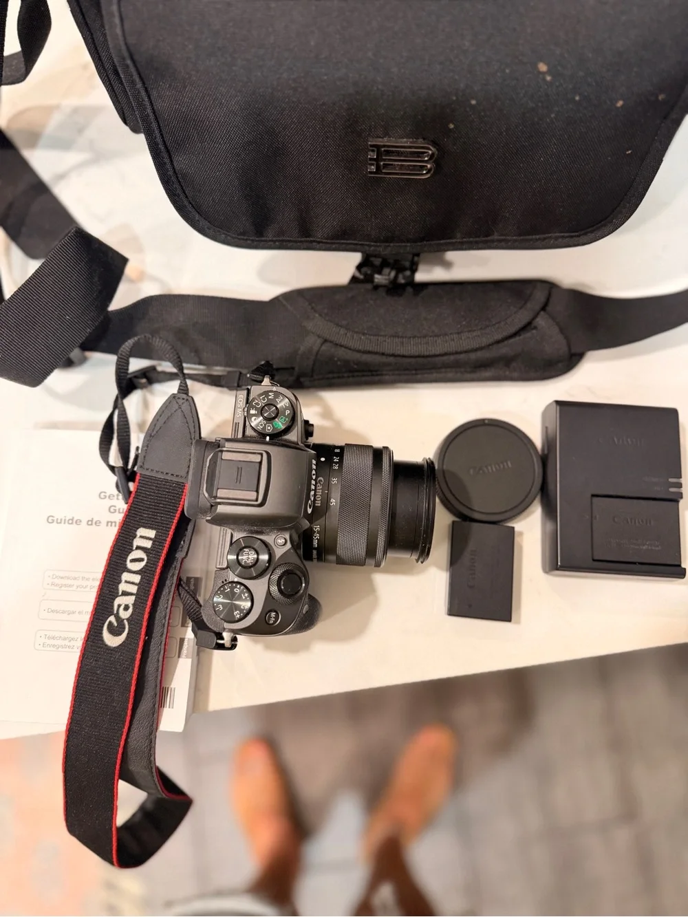 Canon Black Mirrorless Camera with Black Lens and Accessories